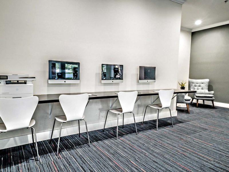 This image shows high technology and faster innovation of TGM Andover Park for having a computer bar for community amenities that's ideal for everyone.