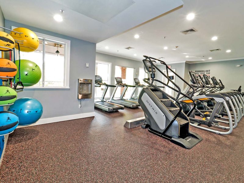 This image showcases commercial fitness with State-of-the-art 2-level athletic club with Matrix Series 7xi equipment that is essential for community amenities. It offers a different weight of kettlebells that is good for point gravity off-centered.