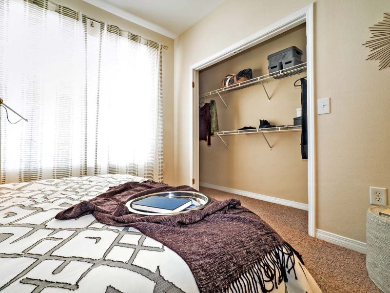 This image is a Premium Apartment Feature that displays a spacious sized bedroom and power outlets with USB ports.